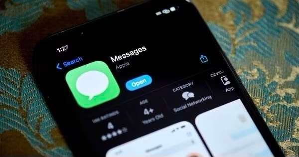 The Apple Messages app in the Apple App Store on a smartphone arranged in New York, US, on Thursday, Dec. 7, 2023. Apple Inc.'s iMessage service looks set to win a carve out from new European Union antitrust rules to rein in Big Tech platforms after watchdogs tentatively concluded that it isnt popular enough with business users to warrant being hit by the regulation. Photographer: Gabby Jones/Bloomberg